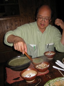Ladle tea into bowls, add sweet condiments and puffed rice to taste.
